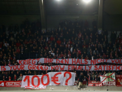UEFA investigating Bayern after fans throw fake money in protest over Champions League prices