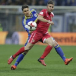 9-man Greece holds Belgium to 1-1 in European qualifying (The Associated Press)
